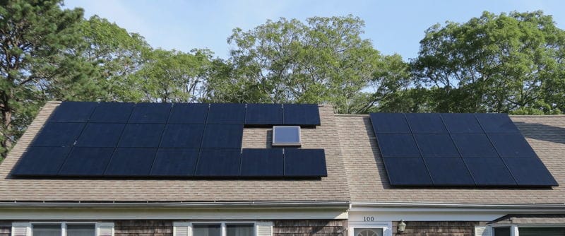 Photo of Roof top SunPower solar panels that provide all of the electricity to Cape Cod Upholstery Shop located in South Dennis, Ma