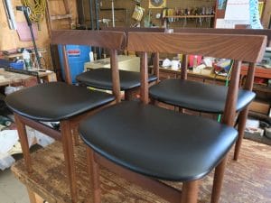 Teak Danish Chairs in a Contract Grade Black Vinyl | Upholstered by Cape Cod Upholstery Shop | Located in South Dennis, MA