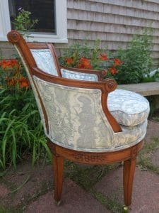 Side view of an exposed wood barrel swivel chair | Upholstered in a JF Fabrics Crypton | Upholstered by Cape Cod Upholstery Shop | Located in South Dennis, MA