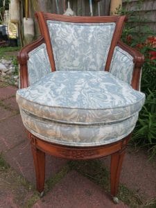 Front view of an exposed wood barrel swivel chair | Upholstered in a JF Fabrics Crypton | Upholstered by Cape Cod Upholstery Shop | Located in South Dennis, MA