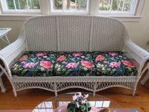 Antique Wicker Sofa | Upholstered in a Schumacher Chintz Floral Print | Upholstered by Cape Cod Upholstery Shop | Located in South Dennis, MA