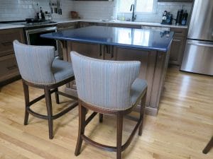 Kitchen Island Stool Backs | Detailed with Decorative Brass Nail Trim | Upholstered in Sunbrella Escapade-Electro | Upholstered by Cape Cod Upholstery Shop | Located in South Dennis, MA