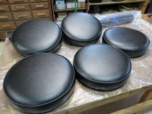 Round Black Vinyl Bar Stool Seats | Boxed Style Seats with Welting Top and Bottom | Upholstered by Cape Cod Upholstery Shop | Located in South Dennis, MA