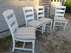 Set of four kitchen chairs | Upholstered in a Sunbrella stripe | Upholstered by Cape Cod Upholstery Shop | Located in South Dennis, MA