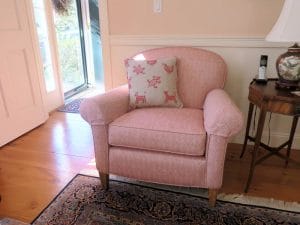 Upholstered Arm Chair with embroider Pillow | Upholstered in a Jane Shelton Fabic Willingham Red | Upholstered by Cape Cod Upholstery Shop | Located in South Dennis, MA 02660