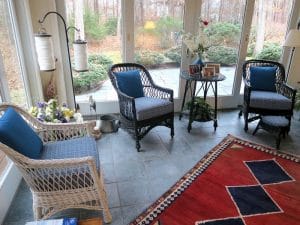 Wicker chairs with removable seat cushion and back pillow | Upholstered in a Stout Fabrics and Greenhouse Fabrics stripe and solid | Upholstered by Cape Cod Upholstery Shop | Located in South Dennis, MA 02660