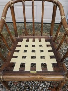 Pirelli Rubber Webbing with Clips, installed on a McGuire stick wicker chair | Upholstered by Cape Cod Upholstery Shop | Located in South Dennis, MA 02660