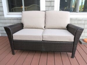 Brown Outdoor Wicker Love Seat | Cushions upholstered in Sunbrella Blend-Sand | Upholstered by Cape Cod Upholstery Shop | Located in South Dennis, MA 02660