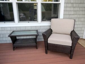 Brown Outdoor Wicker Chair | Cushions upholstered in Sunbrella Blend-Sand | Upholstered by Cape Cod Upholstery Shop | Located in South Dennis, MA 02660