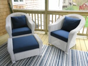 Lloyd Flanders white outdoor wicker chairs and ottoman | Cushions upholstered with Sunbrella Spectrum Indigo outdoor fabric | EZ-Dri foam inserts | Upholstered by Cape Cod Upholstery Shop | Located in South Dennis, MA 02660