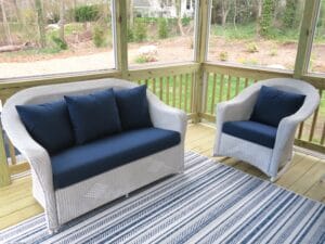 Lloyd Flanders white outdoor wicker chair and love seat | Cushions upholstered with Sunbrella Spectrum Indigo outdoor fabric | EZ-Dri foam inserts | Upholstered by Cape Cod Upholstery Shop | Located in South Dennis, MA 02660