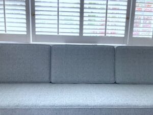 Close-Up view of Built-in bench seating | One 85" long seat cushion and three back cushions | All new 2.6 density CertiPur-US Foam | Upholstered with a Greenhouse Fabric Crypton Finish | Upholstered by Cape Cod Upholstery Shop | Located in South Dennis, MA 02660