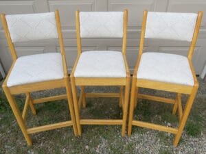 Front view of matching wood bar stools | Upholstered in a geometric pattern fabric | Upholstered by Cape Cod Upholstery Shop | Located in South Dennis, MA 02660