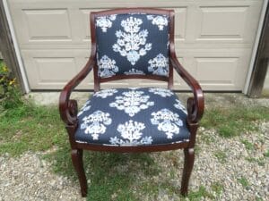 Front view of a wood arm chair upholstered in a cotton screen print fabric | Upholstered by Cape Cod Upholstery Shop | Located in South Dennis, MA 02660