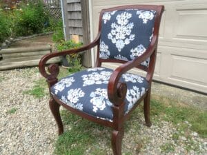 Side view of a wood arm chair upholstered in a cotton screen print fabric | Upholstered by Cape Cod Upholstery Shop | Located in South Dennis, MA 02660