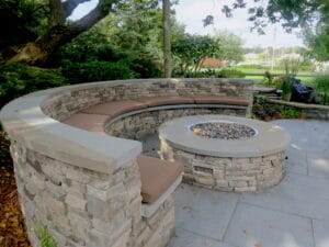 Five semi-circular fire pit cushions with a salt water view | Upholstered on the top and sides with a Sunbrella Canvas Chestnut and Phifertex mesh fabric on the bottom | Ez-Dri outdoor foam | Upholstered by Cape Cod Upholstery Shop | Located in South Dennis, MA 02660