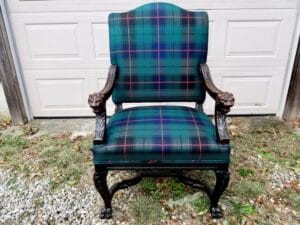 Antique lions head throne chair, front view. Upholstered in a 100% wool Tartan fabric imported from Scotland | Wood restoration by Wesley Woodworking | Upholstered by Cape Cod Upholstery Shop | Located in South Dennis, MA 02660