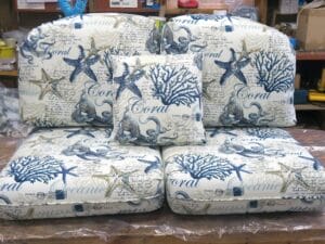 Seashore themed cushions for wicker furniture | Seashore pattern indoor-outdoor fabric | Upholstered by Cape Cod Upholstery Shop | Located in South Dennis, MA 02660