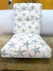 Wicker chair cushions with a starfish print on cotton fabric | Upholstered by Cape Cod Upholstery Shop | Located in South Dennis, MA 02660