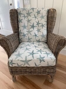 Blue Starfish on a white background cotton fabric for a wicker chair | Upholstered by Cape Cod Upholstery Shop | Located in South Dennis, MA 02660