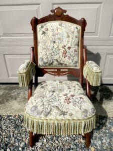 Antique walnut folding parlor chair with a vintage tapestry fabric and fringe | Upholstered by Cape Cod Upholstery Shop | Located in South Dennis, MA 02660