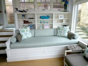 Built-in bench cushions. Bench seat cushion is 100" long with three loose back cushions, two round bolsters and accent throw pillows. Cushions fabricated by Cape Cod Upholstery Shop | Located in South Dennis, MA 02660