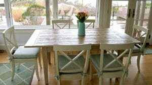 Set of 6 Dining room chairs overlooking sand dunes and Atlantic ocean. Loose cushions with ties, fabricated using a tweed style fabric and 2.5" foam and dacron. Cushions fabricated by Cape Cod Upholstery Shop | Located in South Dennis, MA 02660
