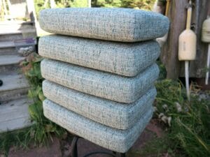 Seat of 6 Dining Chair Cushions. Cushions fabricated without welting cord in a blue tweed fabric. Cushions fabricated by Cape Cod Upholstery Shop | Located in South Dennis, MA 02660