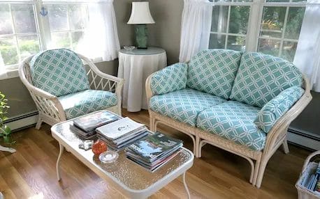 Rattan Chair & Sofa. Cushions fabricated using a polyester geometrical print. Cushions fabricated by Cape Cod Upholstery Shop | Located in South Dennis, MA 02660